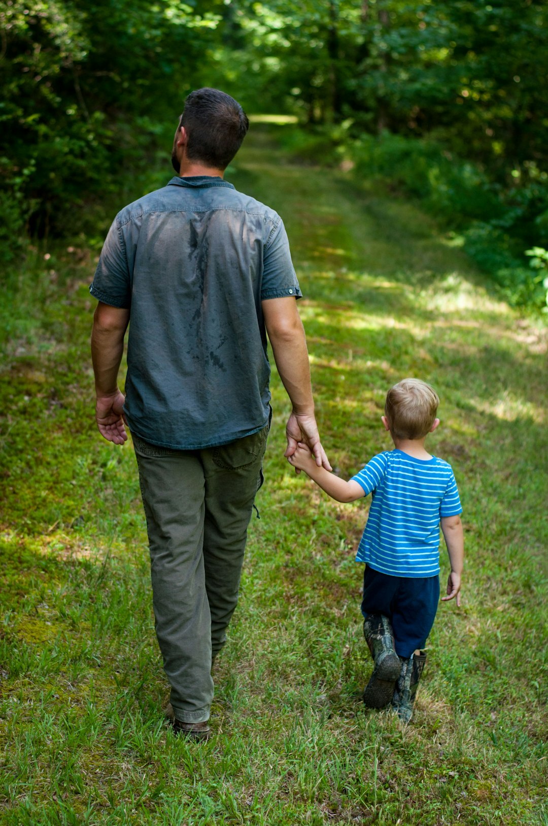 father and child walking